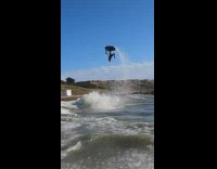 Guy does flip with jet ski in the air 