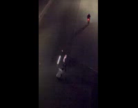 Man points at street ceilings screen for video