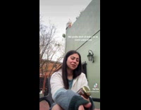 Woman struggles to open jar lid 