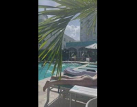 Woman walks and strut on the stairs poolside