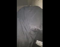 Black sweater guy smokes under blanket flash