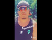 Guy black shirt green alien lip syncs 