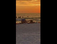 Guy take photo girl butt beach sunset