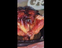 Guy whistles and looks at rotisserie chicken 