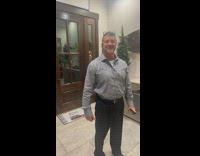 Guy dressed as elf excited santa 