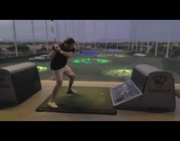 Black shirt guy hits golf ball lights 