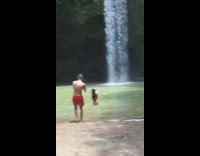 Different groups of people posing waterfall water hole