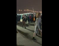 Girl poses by portable bathrooms