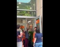 Home depot staff shooing pigeon out from store