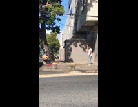 Guy sing play guitar sit on stone
