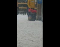 Man takes picture in snow with no shoes on