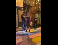 Lady rubs colorful powder on body pt. 3