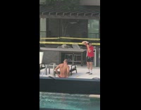 Red shorts guy pool yellow caution tape 