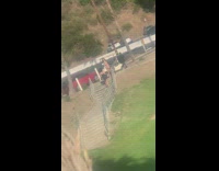 Woman in dress pose stairs of golf course