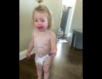 Little girl draws on herself and baby 