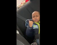 Little boy pushes another boy away because his breath stinks