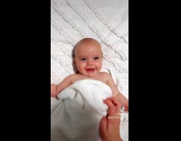 Submitter Plays with Baby in White Towel