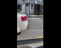 White car found with spikes near its trunk 