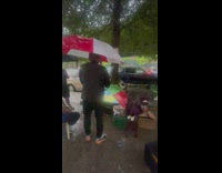 Guy watch game in television outside at the park 