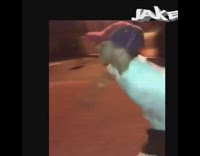 guy white shirt swinging on ride falls down