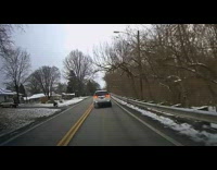 Wheelchair with grocery roll across the road
