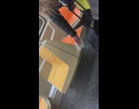 corona virus lady disinfects orange seat  