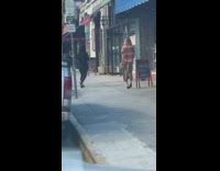 Woman stripes brown dress walk model sidewalk Part 1