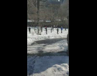 People holding swords practice martial arts park 