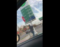 Man changing gas station prices with stick 