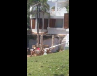 Woman black swimsuit sit chair folded umbrella