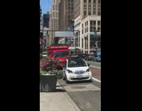 Guy plays trombone instrument NYPD traffic car