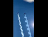 Jet planes fly blue sky white trail 