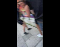 Restaurant workers removing absolut rainbow pride day sign.