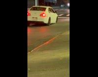 Car drives on road with missing tire