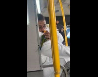 Man pets the bird on his shoulder