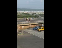 Neon green shirt girl tiktok dances beach 