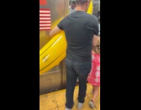 Man carries giant inflatable banana on subway