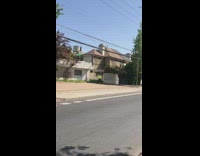 Man neon green workout video front yard