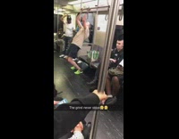 Man does pull ups on handrail bar on subway train