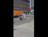 Elderly man and woman dancing for a video on street