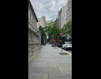 Large inflatable mouse rat on sidewalk trash 