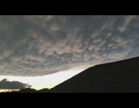Round cloud formation at a cloudy sundown