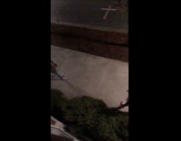 Red hat guy sidewalk empty parking spots