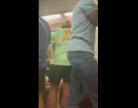 Packed subway person with mickey mouse socks