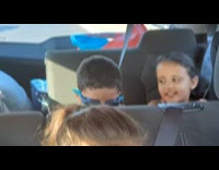 Boy inside car move his head to music