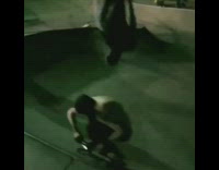 Guy skateboards under guy doing backflip skatepark 