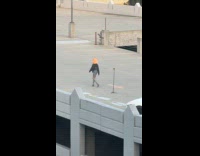 Woman furry head dances rooftop parking lot