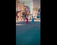 Woman pink pajama Man blue pajama dance empty street