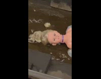 Broken mannequin torso on the subway train track