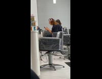 Woman getting hair done yelling at phone salon